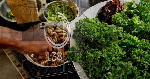 Preparing kale and shrimp with digital hud overlay on kitchen countertop, healthy cooking