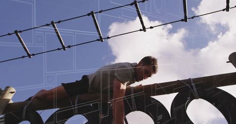 Man Overcoming Obstacle Course Challenges with Determination