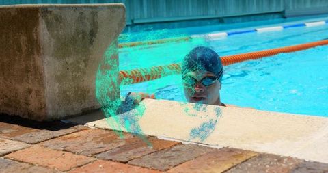 Competitive Swimmer Holding Edge of Outdoor Pool During Practice