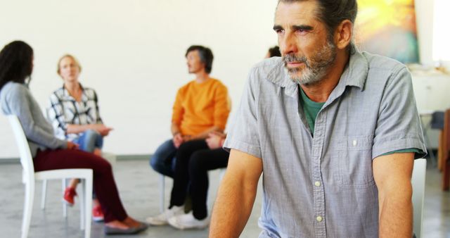 Middle-Aged Man Attending Support Group Meeting - Download Free Stock Images Pikwizard.com