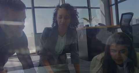 Collaborative Teamwork Discussion in Modern Office Setting