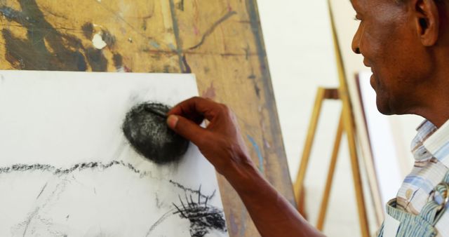 Artist Creating Charcoal Drawing on Canvas - Download Free Stock Images Pikwizard.com