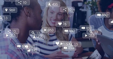 Diverse group networking in cafe with digital interactions