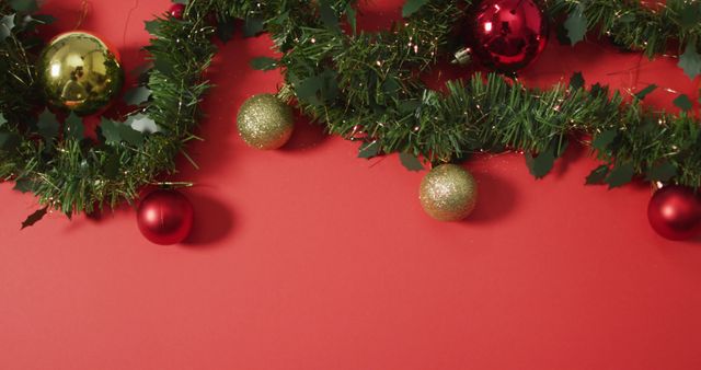 Christmas decorations with baubles and copy space on red background. christmas, tradition and celebration concept image.