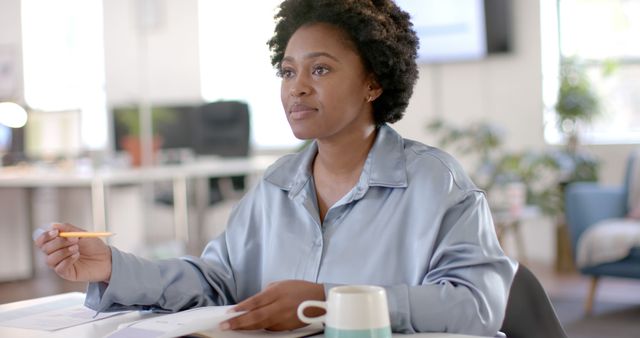 Focused Businesswoman Working in Modern Office with Coffee - Download Free Stock Images Pikwizard.com