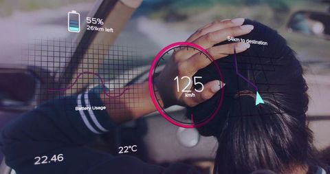 Woman driving with ar display on futuristic dashboard in car