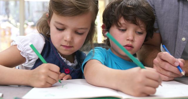 Focused Children Coloring Together in Classroom - Download Free Stock Images Pikwizard.com