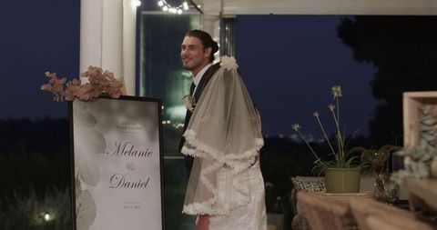 Bride and Groom Enjoying Evening Wedding Reception Outdoors