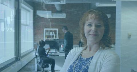 Confident Businesswoman Overseeing Innovative Tech Team