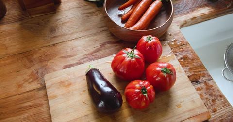 Fresh organic vegetables on rustic kitchen counter