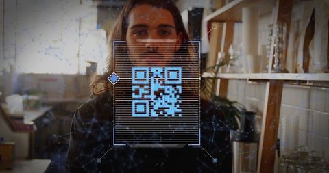 Qr code overlay on craftsman in creative studio environment