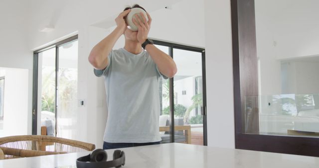 Man Drinking Coffee in Modern Kitchen Interior - Download Free Stock Images Pikwizard.com