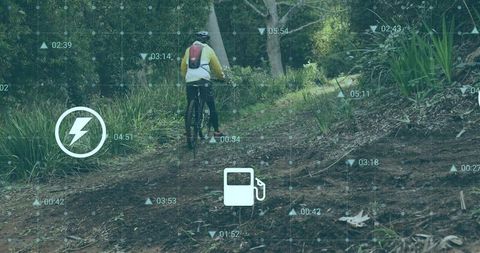 Explorer riding mountain bike on scenic forest trail with hud display