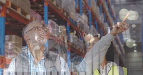 Logistics Experts Analyzing Data in Modern Warehouse Environment