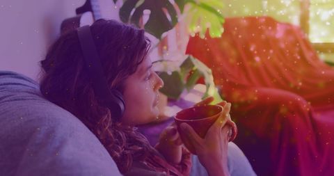 Relaxed Woman Enjoying Coffee Amidst Magical Atmosphere