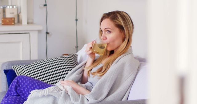 Relaxed Woman Enjoying Herbal Tea at Home - Download Free Stock Images Pikwizard.com