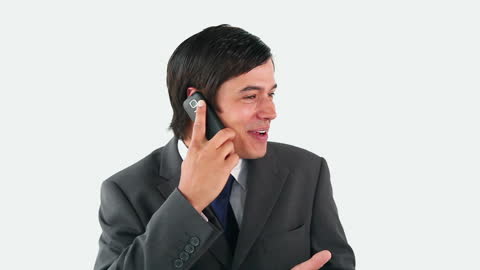 Smiling Businessman Engaged in Lively Phone Call