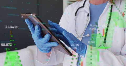 Healthcare Professional Using Tablet with Data Overlays in Medical Setting