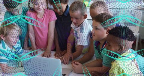 Diverse Children Collaborating on Laptop Project in Classroom