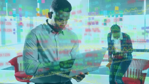 Businessman Using Tablet with Financial Graph Overlay in Modern Workspace