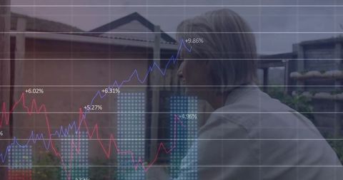 Mature woman analyzing data with financial graphics in residential setting