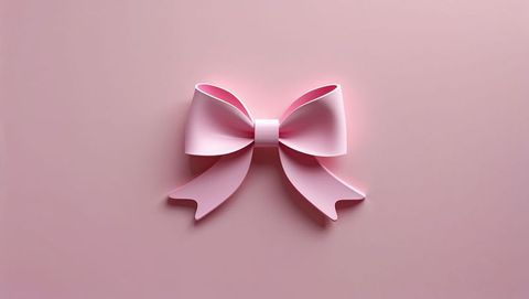 Pastel Pink Ribbon Bow on Soft Pink Background