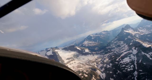 Private aircraft flying over snowcovered mountain 4k