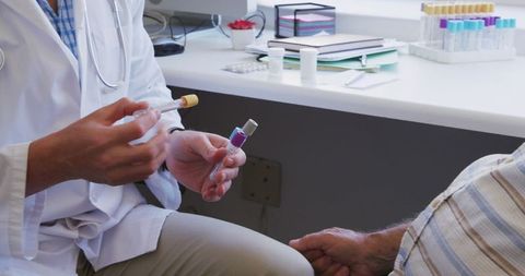 Doctor Discussing Treatment with Senior Patient