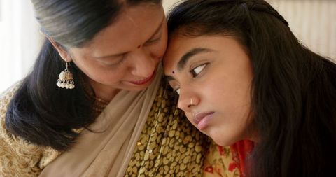 Tender Moment Between Indian Mother and Daughter