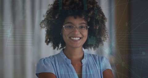 Smiling african american woman interacting with virtual interface