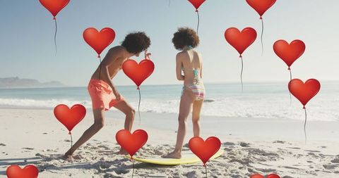 Couple Surfing Adventure Enhanced with Love Icons on Beach - Download Free Stock Images Pikwizard.com