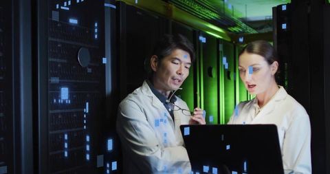 Data center technicians inspecting servers with laptop and digital overlay visuals