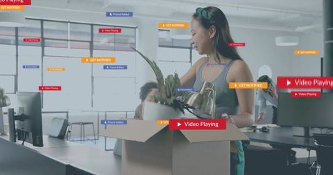 Young woman unpacking office plant with augmented notifications in modern startup
