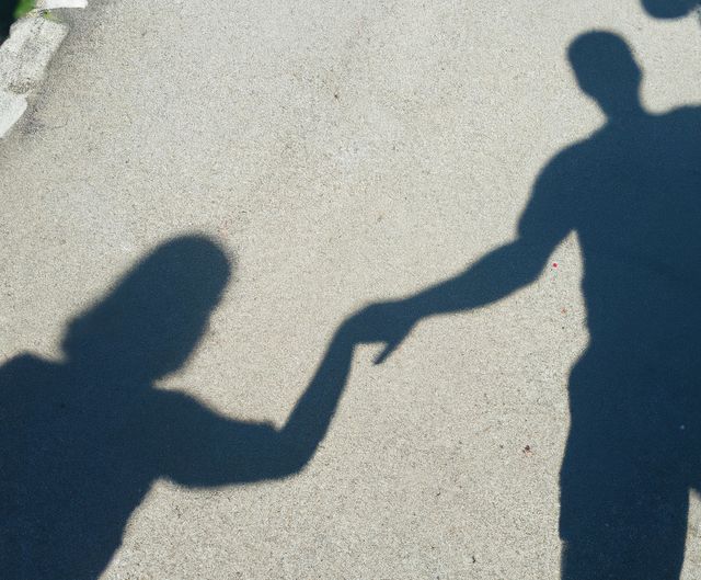 Close up of shadow of people holding hands created using generative ai technology - Download Free Stock Photos Pikwizard.com