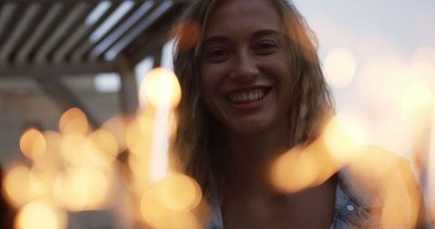 Joyful Celebration with Sparkler on Rooftop Party