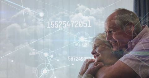 Happy Senior Couple with Digital Data Overlay