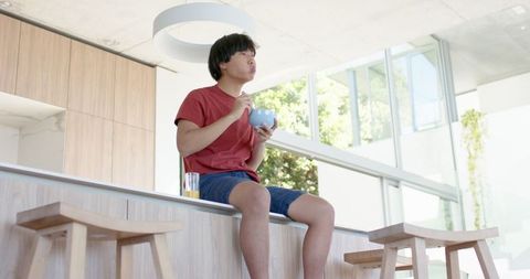 Relaxing by Pool With Bowl of Cereal