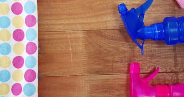 Cleaning Supplies and Colorful Clot on Wooden Surface - Download Free Stock Images Pikwizard.com