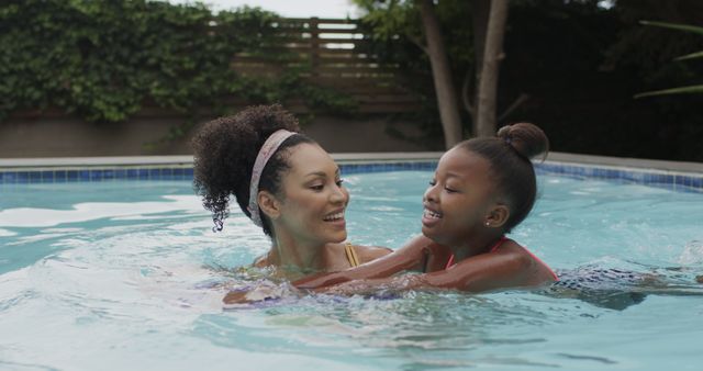 Mother and Daughter Enjoying Time in Pool - Download Free Stock Images Pikwizard.com