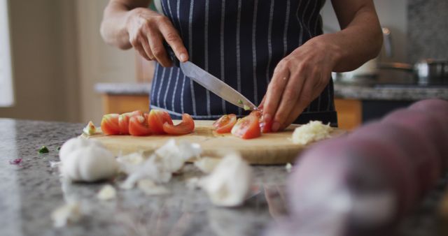 Person Chopping Tomatoes on Wooden Board in Kitchen - Download Free Stock Images Pikwizard.com