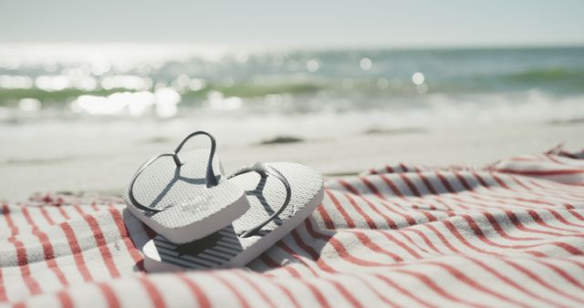 Flip flops on beach towel at sunny beach, copy space - Download Free Stock Photos Pikwizard.com