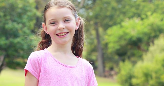 Cheerful Young Girl Smiling in Sunny Park - Download Free Stock Images Pikwizard.com