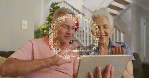 Senior couplevideochat naturally celebrating christmas with technology link