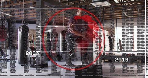 Boxer training with futuristic hud overlay and timeline industrial gym striking heavy bag