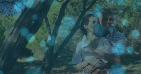 Romantic middle-aged couple in enchanted woodland