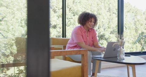 African American Woman Working Using Laptop in Cozy Minimalist Interior