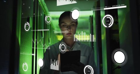 Female IT Technician Analyzing Digital Data in Server Room