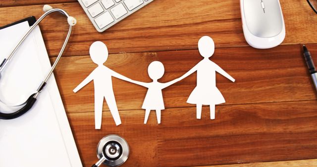 Paper Cutout Family with Medical Devices on Wooden Table - Download Free Stock Images Pikwizard.com