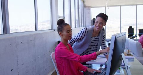 Multi-ethnic Businesswomen Collaborating in Contemporary Office Space
