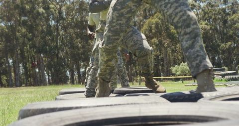 Soldiers Engaging in Military Obstacle Tire Run Training